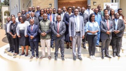 A large group of attendees posing on the steps outside the Prosecution Institute in Loresho, Nairobi, for the Justice Sector Digital Inclusivity workshop held August 2025.